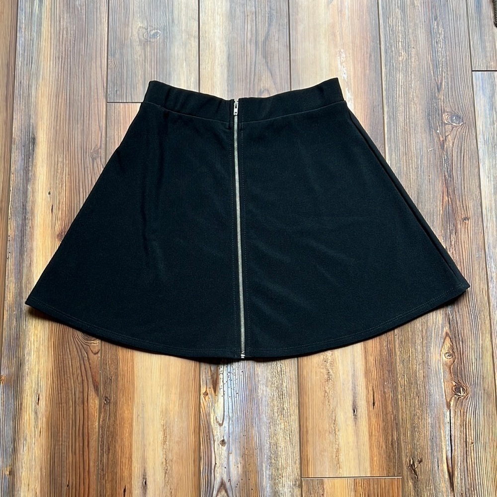 Black mini skirt full zip in a size small.